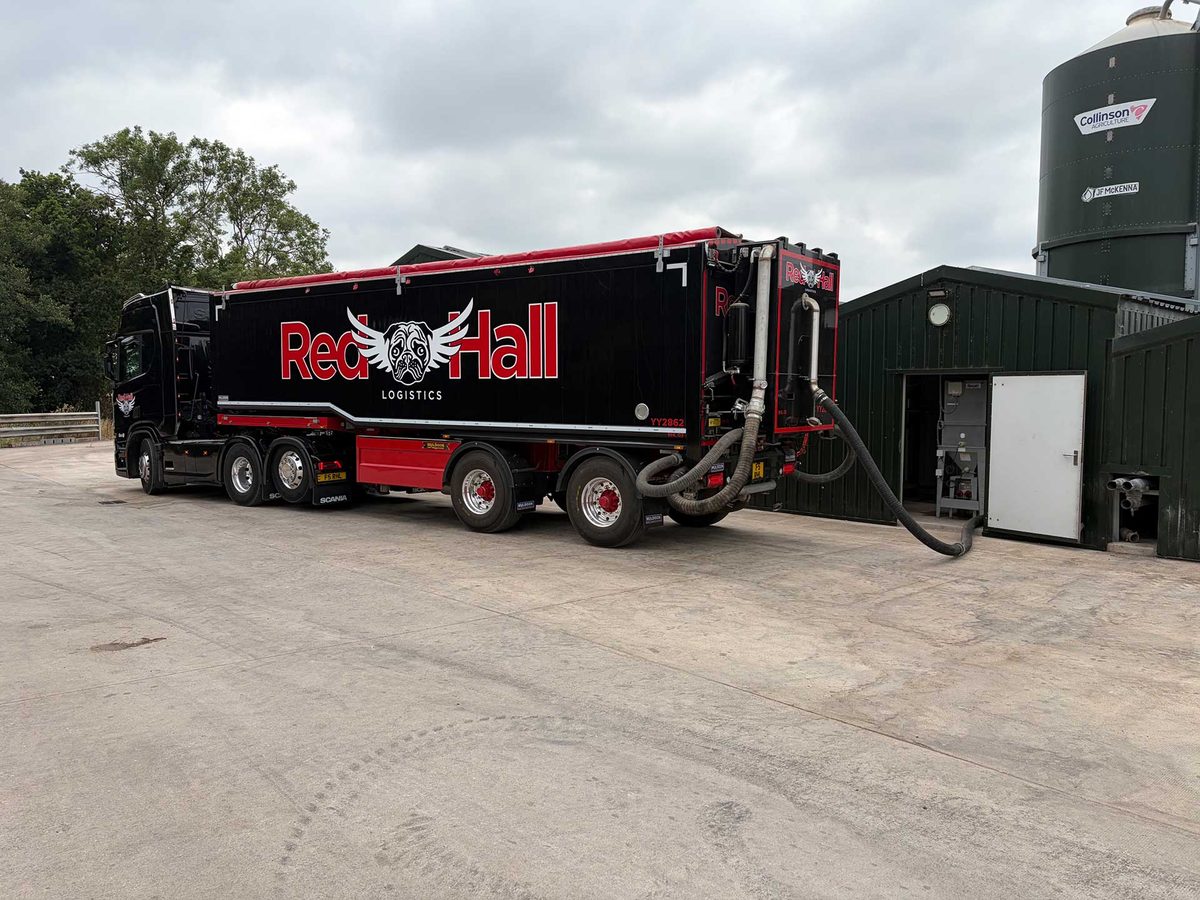 Red Hall Logistics vacuum blower lorry recovering bulk feed from a farm storage silo